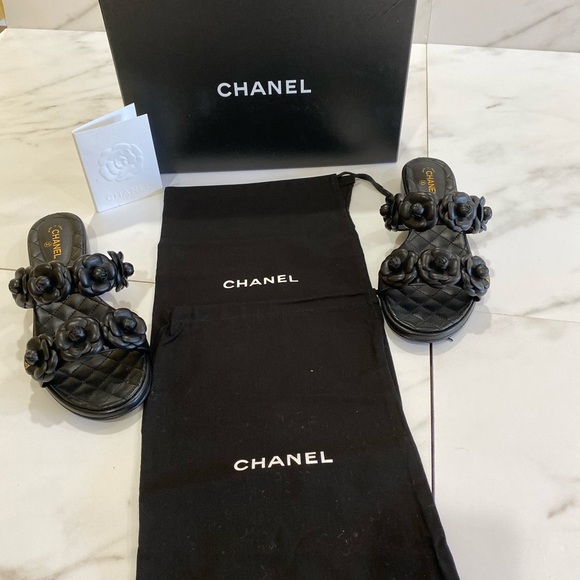 CHANEL Shoes - SOLD! Chanel brand new black camellia flat sandals